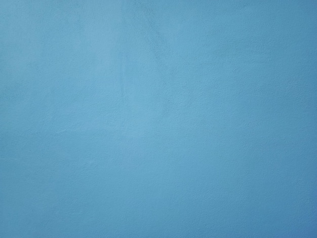 Fondo de pared de cemento azul de superficie lisa en estilo vintage para diseño gráfico o papel tapiz