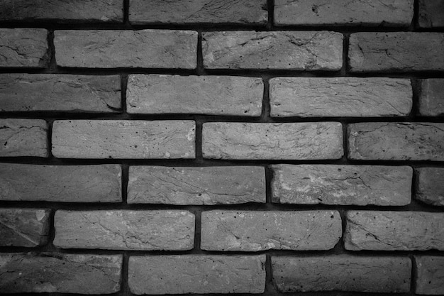 Foto fondo, una pared gris hecha de ladrillos y piedras.