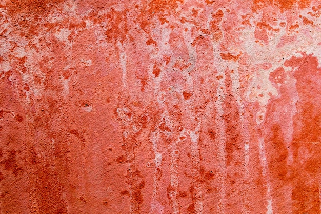 El fondo de la pared del grunge con pintura descascarada