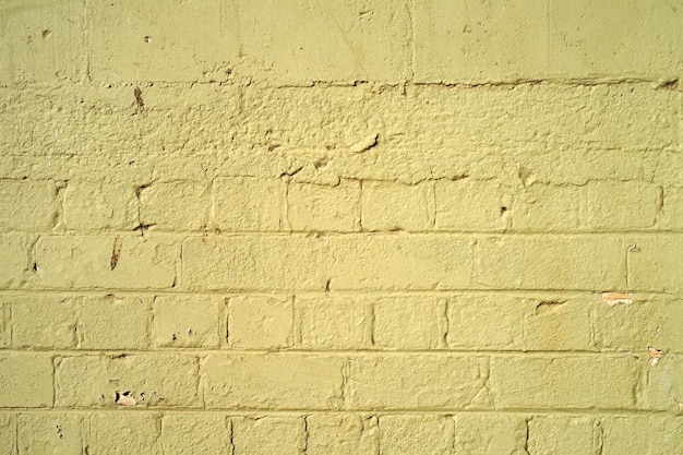 Foto fondo de pared de ladrillo amarillo