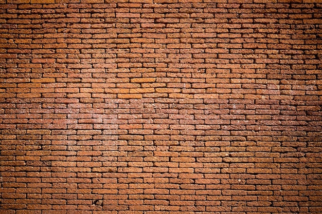 Foto fondo de pared de ladrillo rojo hecho de piedra