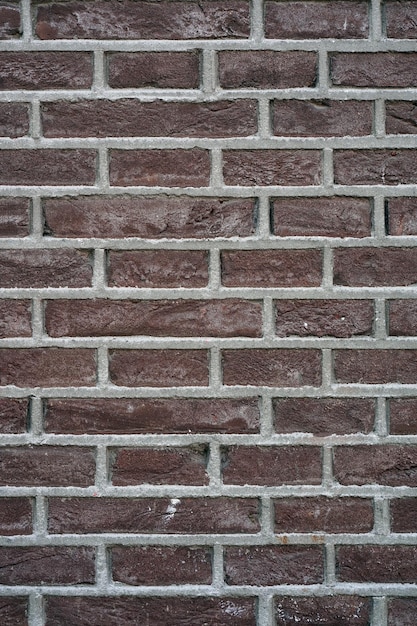 Fondo de pared de ladrillo rojo oscuro