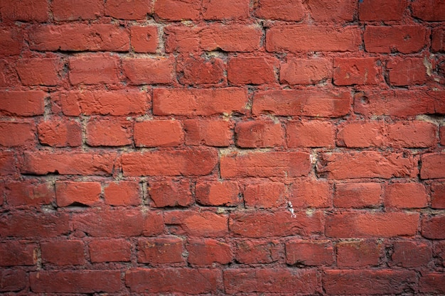 Fondo de pared de ladrillo rojo vacío de una antigua casa de ladrillo