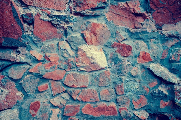 Fondo de pared de piedra vintage oscuro rojo azul