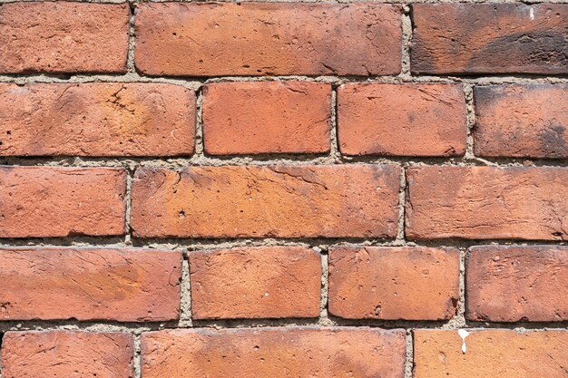 Foto fondo de pared roja de ladrillo vacío de una vieja casa de ladrillo