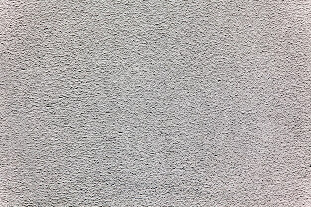 Foto el fondo de la pared de yeso de color gris.