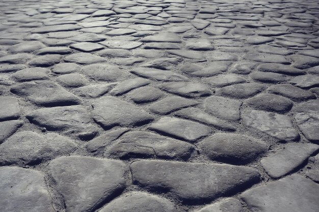 Fondo de pavimento de piedra antigua / pavimento abstracto, adoquines grandes, textura de carretera vieja