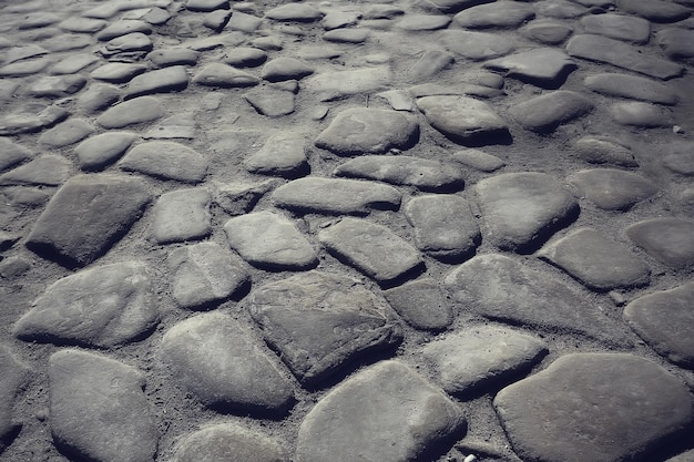 Fondo de pavimento de piedra antigua / pavimento abstracto, adoquines grandes, textura de carretera vieja