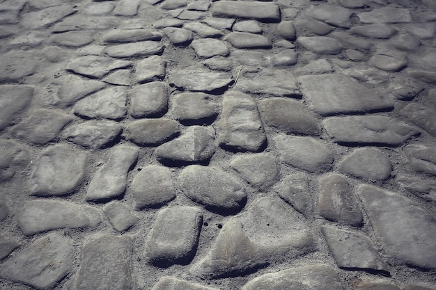 Fondo de pavimento de piedra antigua / pavimento abstracto, adoquines grandes, textura de carretera vieja