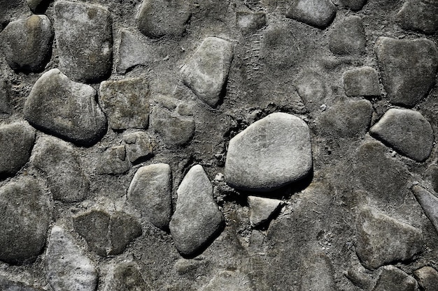 Fondo de pavimento de piedra antigua / pavimento abstracto, adoquines grandes, textura de carretera vieja