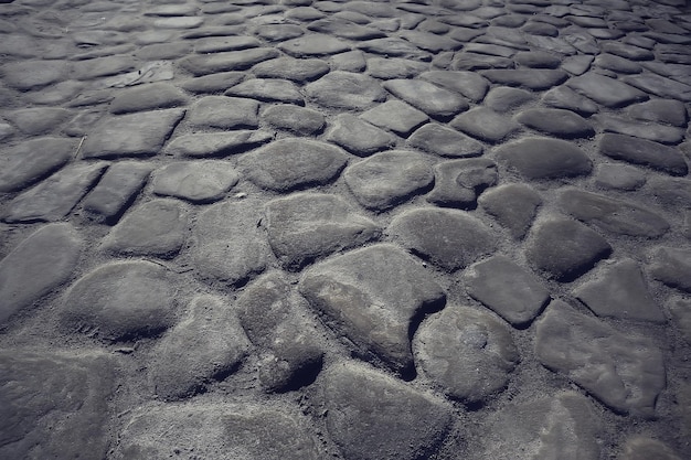 Fondo de pavimento de piedra antigua / pavimento abstracto, adoquines grandes, textura de carretera vieja