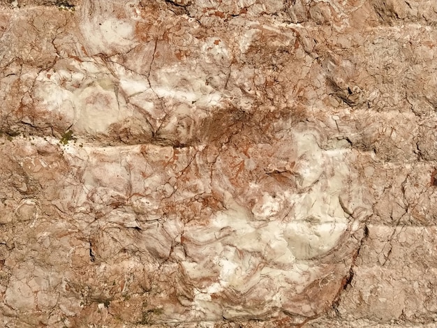 Fondo de piedra colores cálidos textura suelta desigual