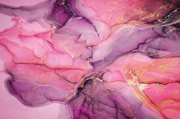 Fondo de pintura abstracta con tinta líquida en colores rosados
