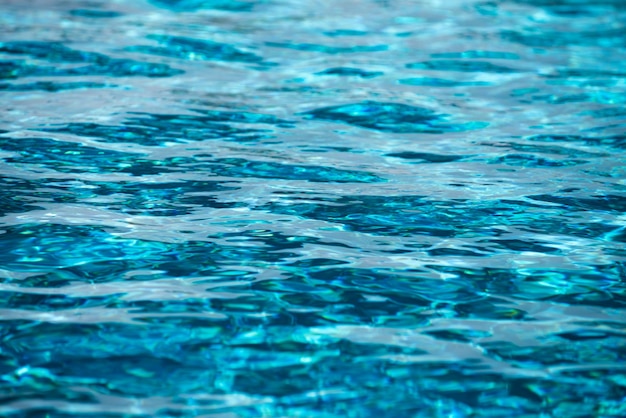 Fondo de la piscina azul de la superficie del agua