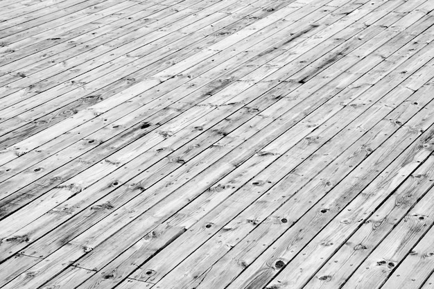 Fondo de piso de madera con tornillos.