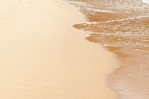 Fondo de playa de arena húmeda con textura