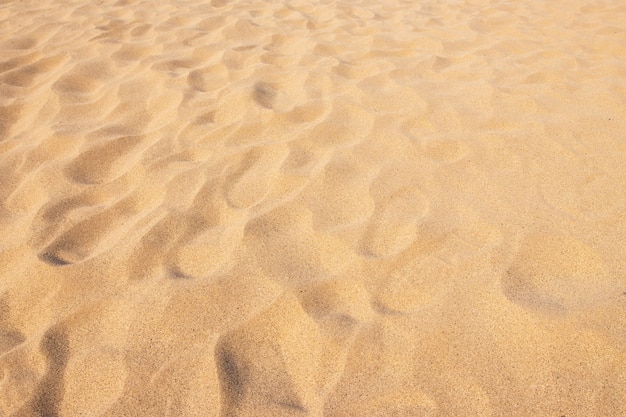 Fondo de playa de arena y patrón de textura con espacio.