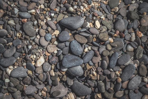 Fondo de playa de guijarros textura de piedras de guijarros