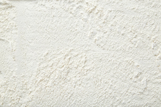 Foto fondo de primer plano de harina de arroz un montón de harina de arroz sobre un fondo blanco textura de harina