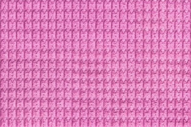 Fondo púrpura de suave tejido lanudo de cerca, textura de macro de textiles