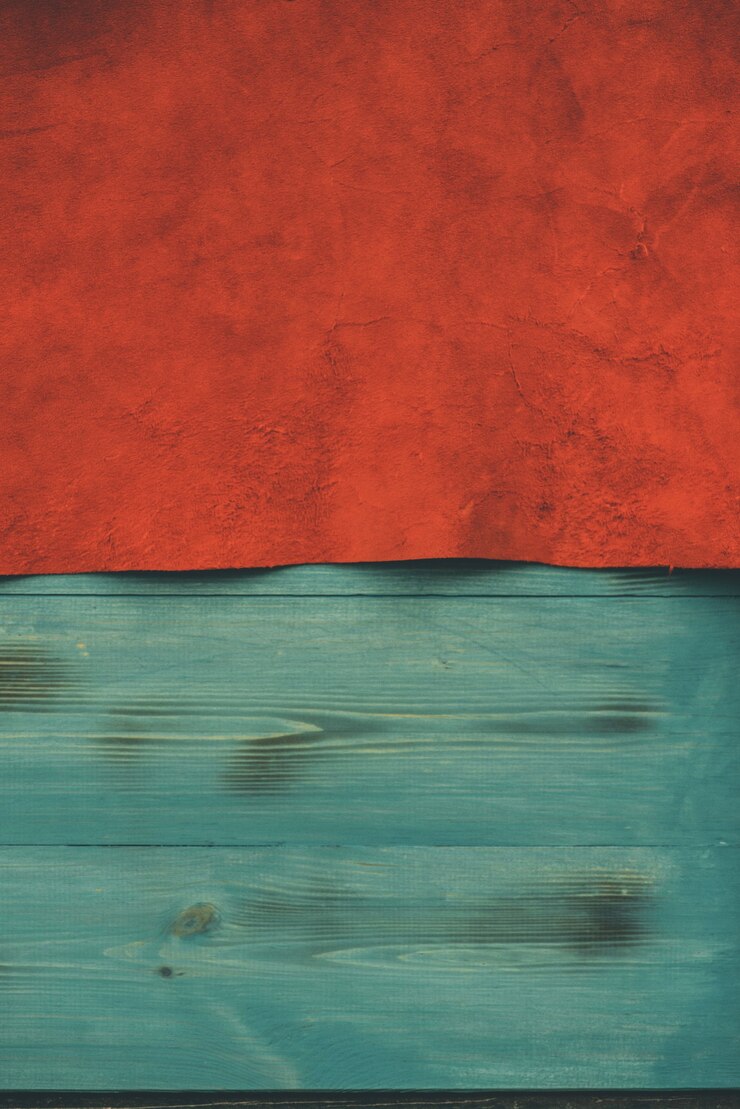 Foto fondo rojo mate de tela de gamuza. textura de terciopelo de cuero sin costuras. material de fieltro.