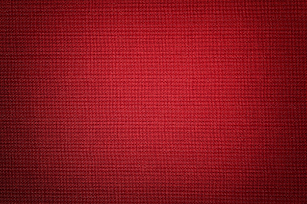 Fondo rojo oscuro de un material textil con mimbre,