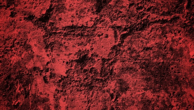 Un fondo rojo con una textura rugosa y un fondo rojo oscuro.