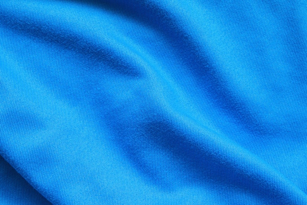 Fondo de ropa deportiva de textura de tela de ropa de camiseta de fútbol azul