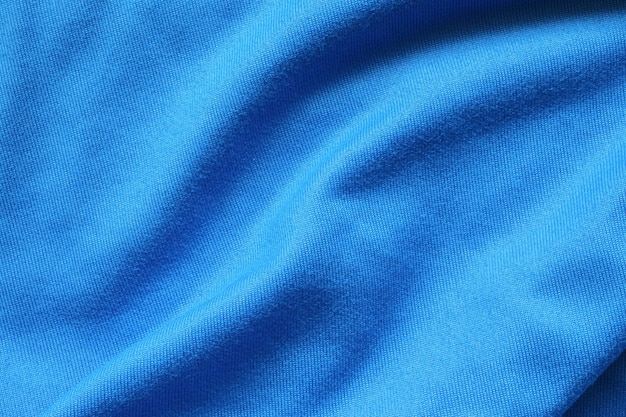 Fondo de ropa deportiva de textura de tela de ropa de camiseta de fútbol azul