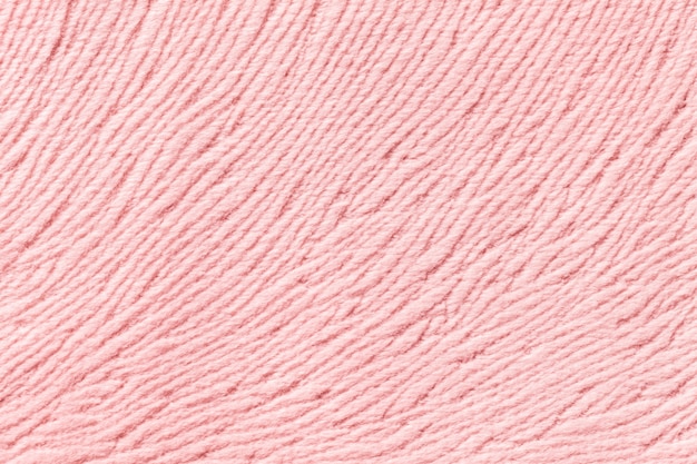 Fondo rosa claro de material textil suave. Tejido con textura natural.