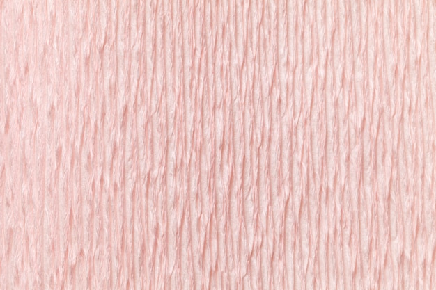 Fondo rosa claro textural del papel acanalado ondulado, primer.