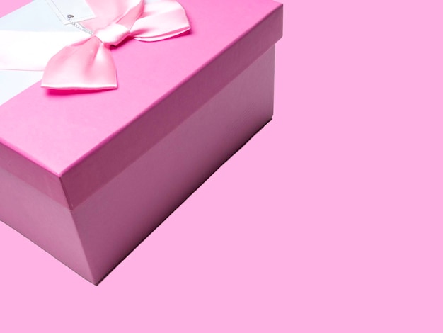 Fondo rosa de vacaciones con lazo de satén rosa de regalo Día de San Valentín Feliz Día de la Mujer Día de la Madre Cumpleaños Boda Navidad espacio para texto