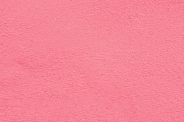 Fondo rosado de la textura de la pared del yeso del cemento color de rosa.