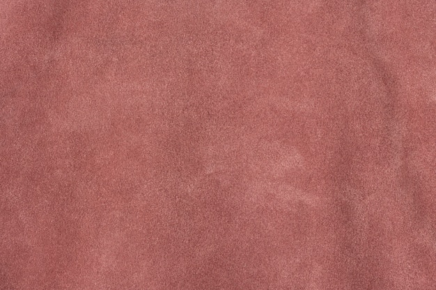 Fondo de superficie de cuero de gamuza con textura rosa oscuro