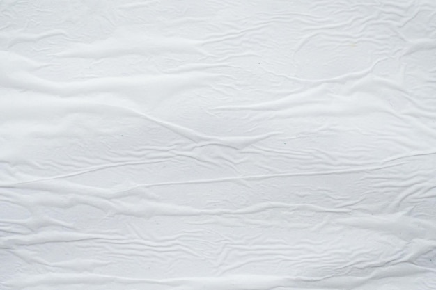 Fondo de superficie de textura de cartel de papel rasgado arrugado arrugado blanco en blanco