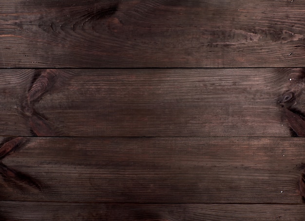 Foto fondo de tablas de madera paralelas de color marrón.