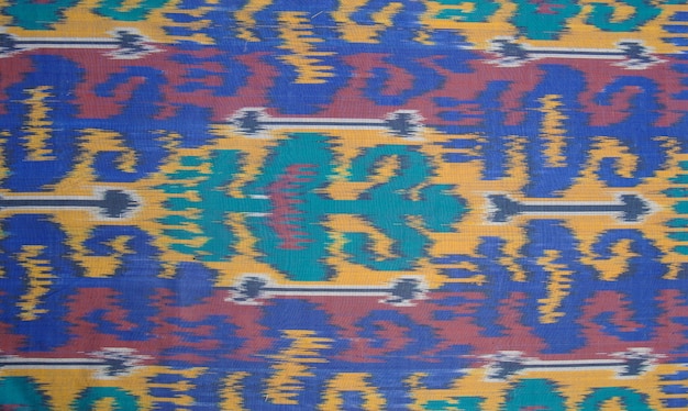 Fondo del tejido y textil con adornos orientales y patrón multicolor
