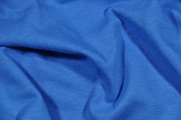 Fondo, tela azul con pliegues.