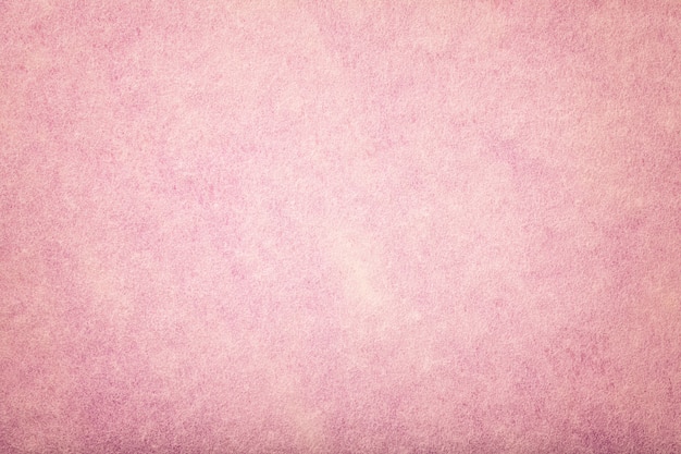 Fondo de tela de gamuza mate rosa claro. Textura de terciopelo de fieltro.