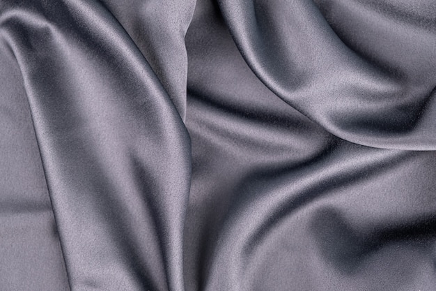 Fondo de tela de satén de seda púrpura azul gris ondulado ondulado