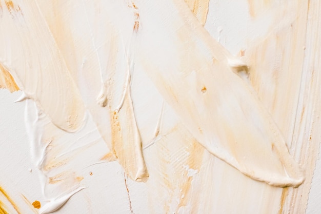 Fondo de textura abstracta artística pincelada de pintura acrílica dorada salpicaduras de aceite de tinta texturizada como telón de fondo de impresión para el diseño de banner flatlay de la marca de vacaciones de lujo