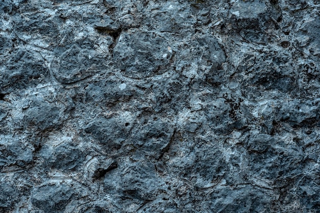 Fondo, textura - antiguo muro de piedra gris áspera