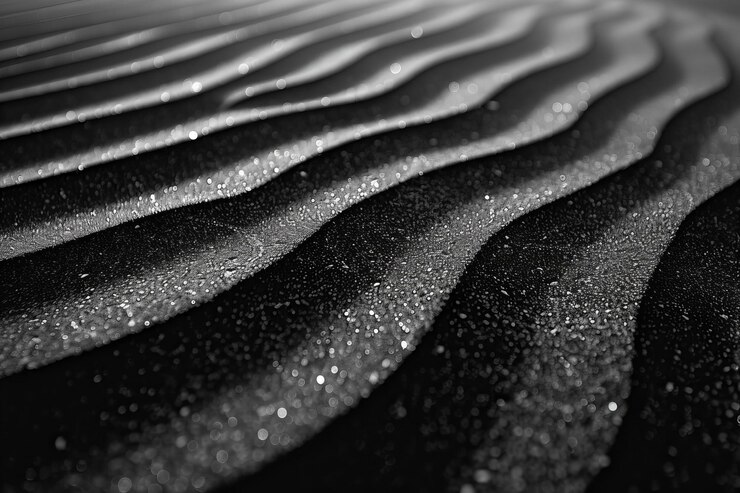 Fondo de textura de arena negra y blanca con ondas y patrones