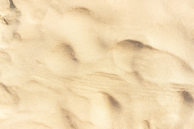 Fondo de textura de arena en la playa. Patrón de textura de arena de mar beige claro, fondo de playa de arena.