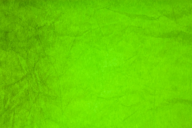 Fondo de textura arrugada de papel verde.