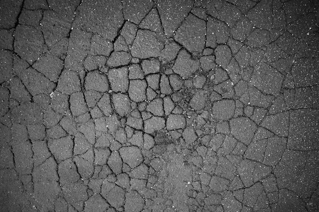 Fondo de textura de asfalto de carretera agrietada