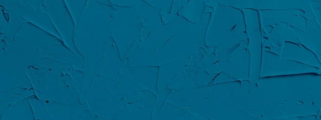 Fondo de textura azul de pasta de relleno aplicada con espátula en trazos y trazos irregulares