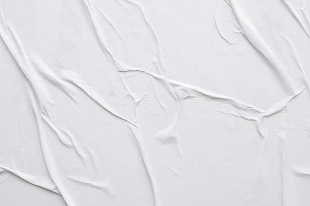 Fondo de textura de cartel de papel arrugado y arrugado blanco en blanco