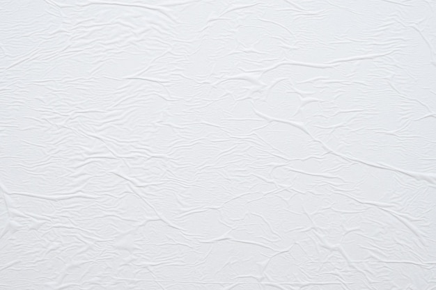 Fondo de textura de cartel de papel arrugado y arrugado blanco en blanco