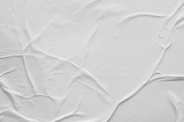 Fondo de textura de cartel de papel arrugado y arrugado blanco en blanco